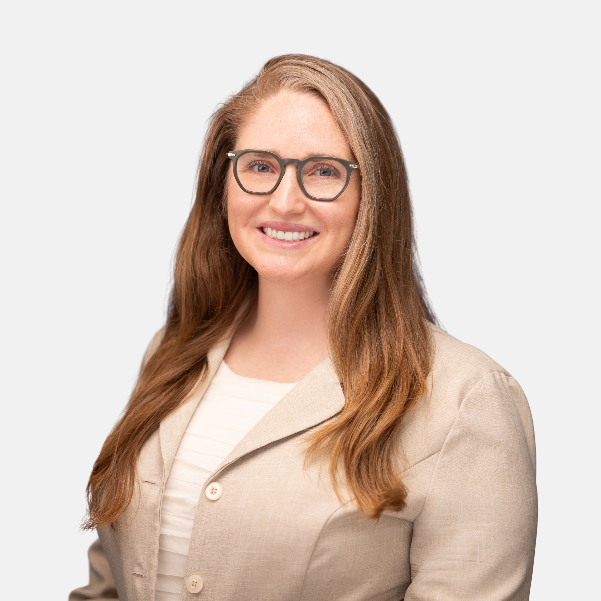 Headshot of Mallory C. Meaney with long light brown hair and glasses, wearing a beige blazer and smiling against a light background